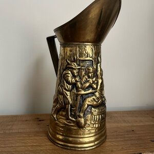 Vintage Gold Decorative Pitcher with intricate engravings.